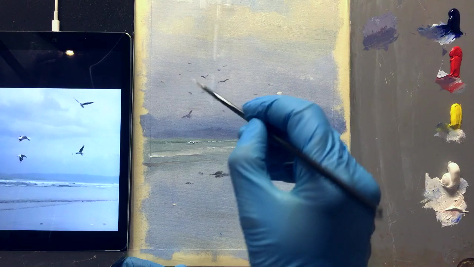 Step 6 — Painting closer seagulls (video frame from the lesson)