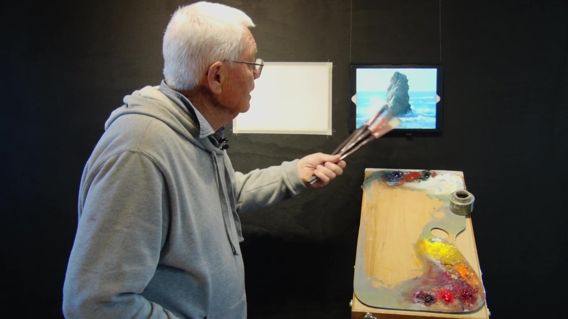 Step 4 — Painting a Rock on the Coast (video frame from the lesson)