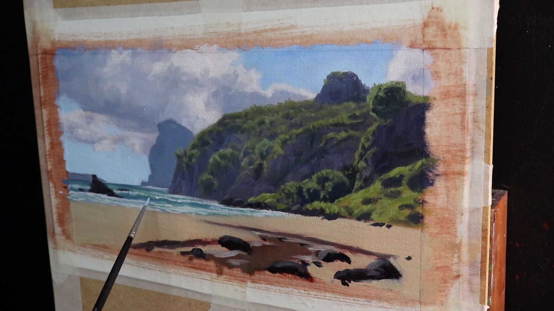 Step 18 — Modelling phase: Beach and rocks (video frame from the lesson)