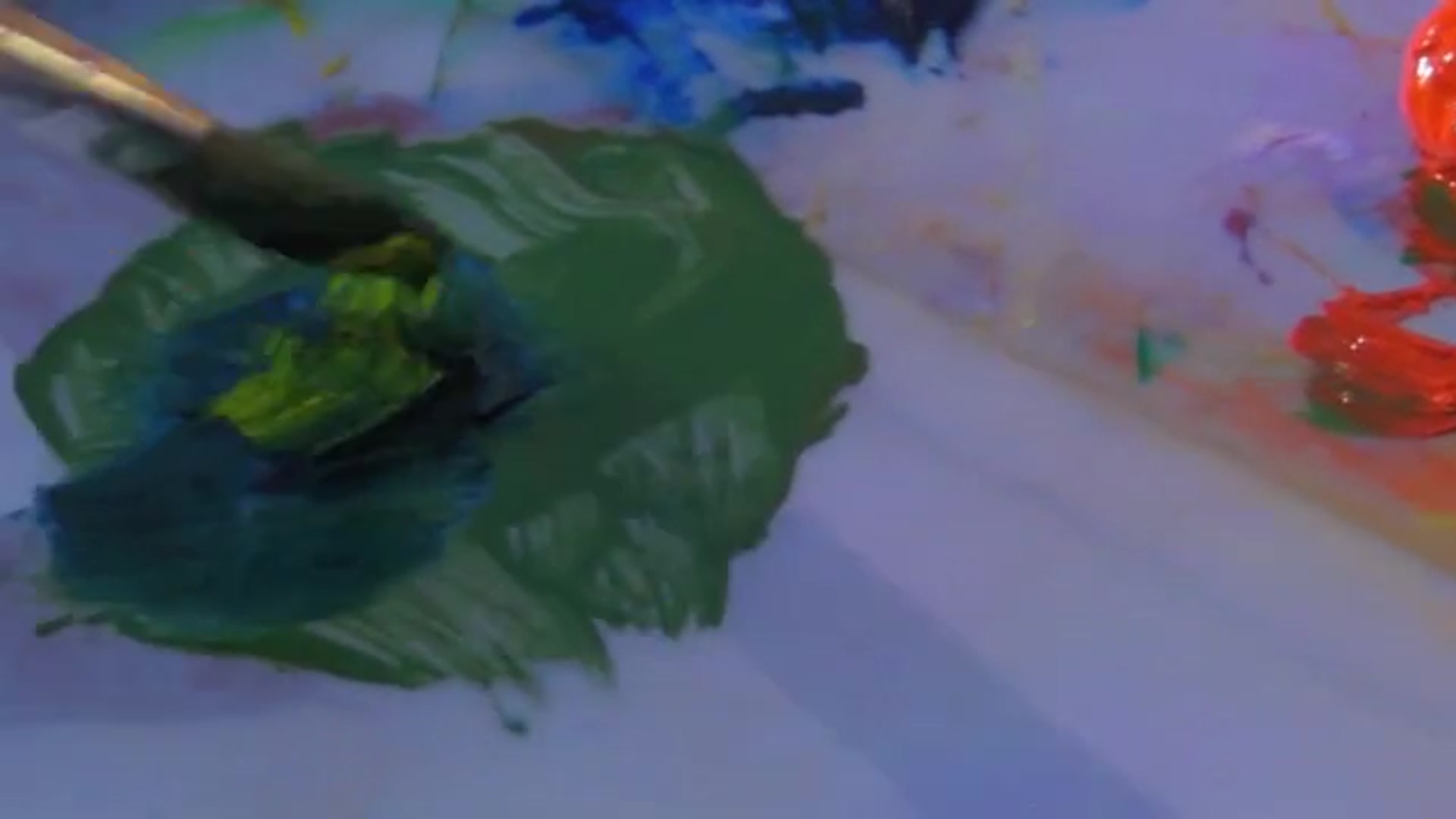 Step 4 — Mixing and applying color for hills (video frame from the lesson)
