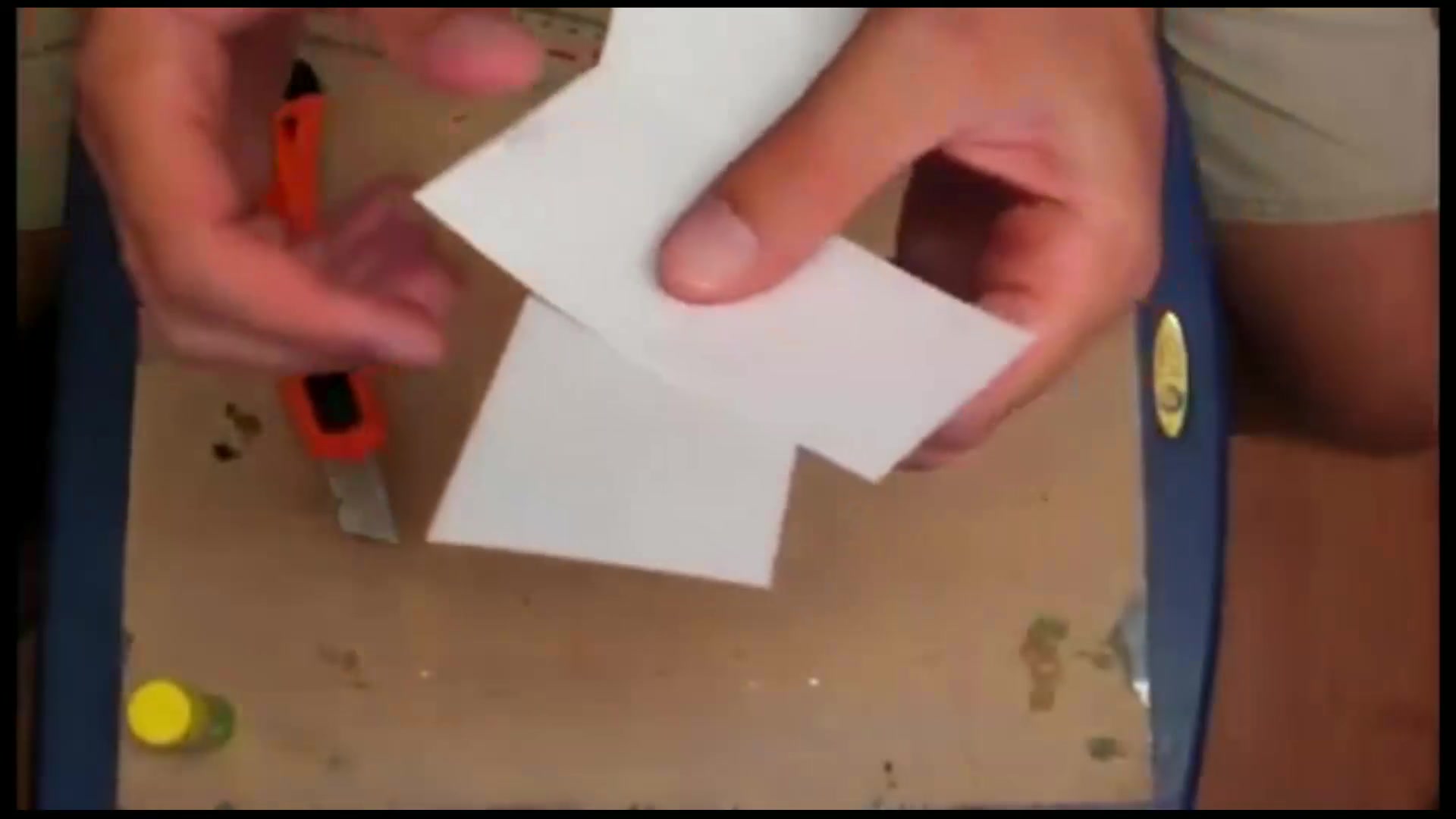 Step 11 — Gluing and Assembly (video frame from the lesson)