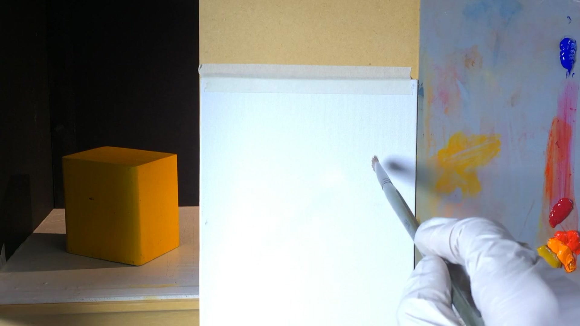 Step 1 — Drawing the cube (video frame from the lesson)